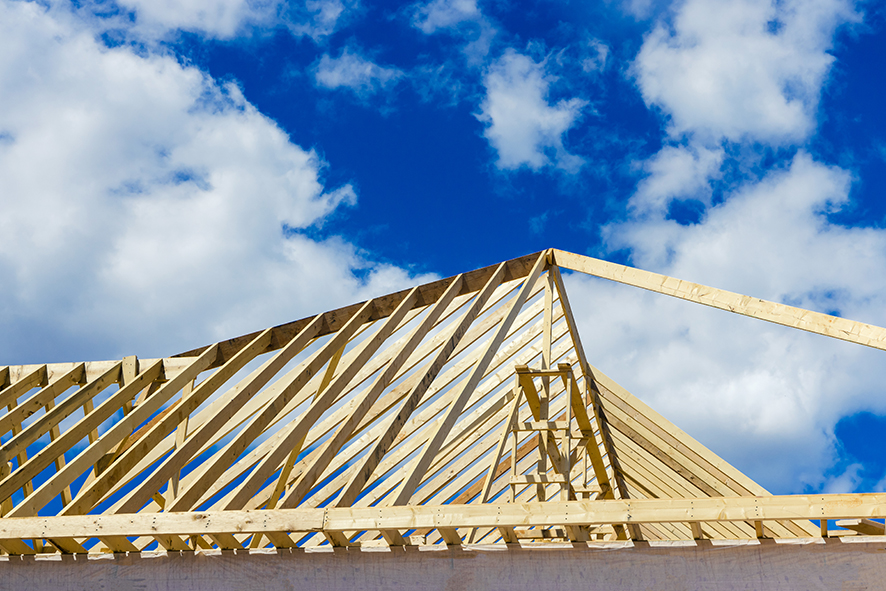 The framing of new residential construction home is unfinished.